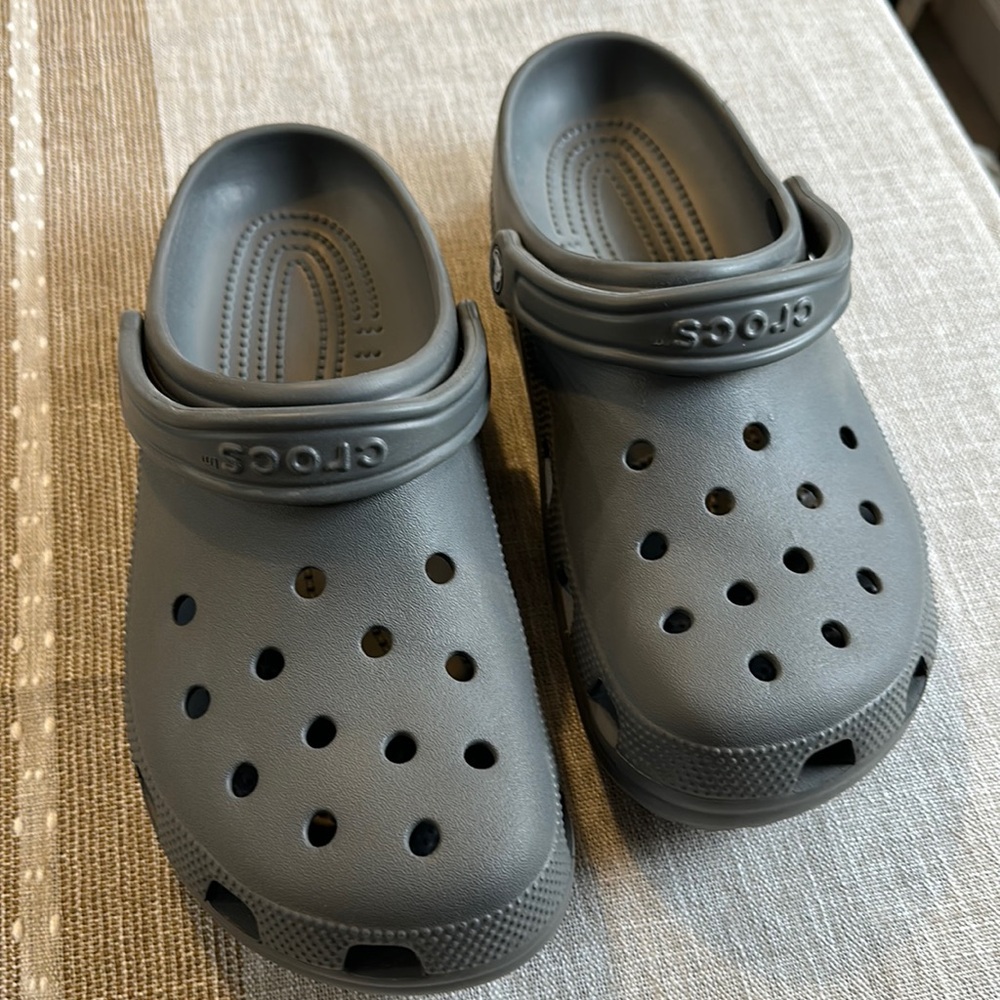 Crocs, men’ size 10, women size 12